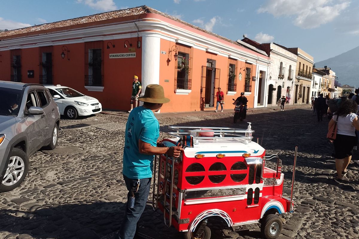 Cobblestone street in central Antigua with colorful colonial buildings