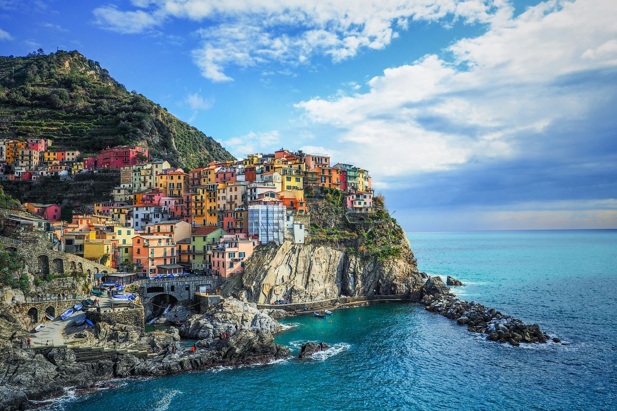 Manarola's colorful houses stacked on a cliff above the sea