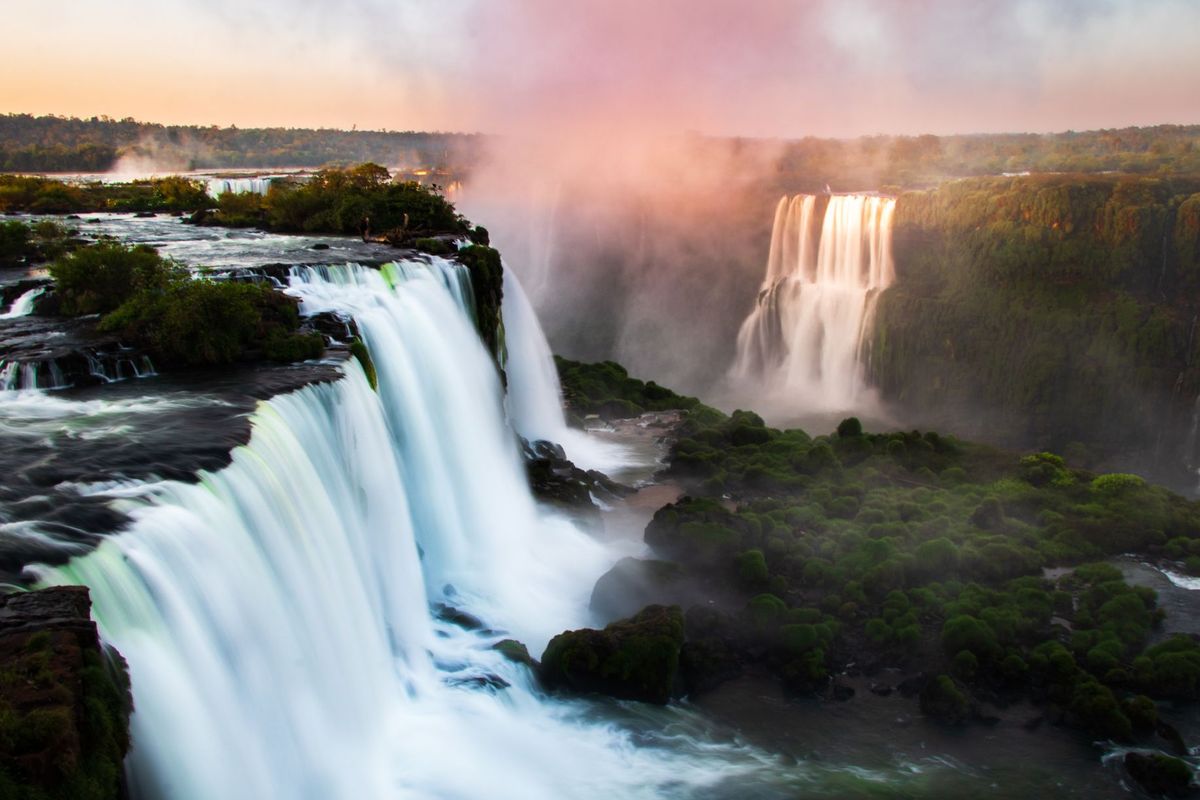 Iguazu Falls at sunset, where the Devil's Throat drops into mist