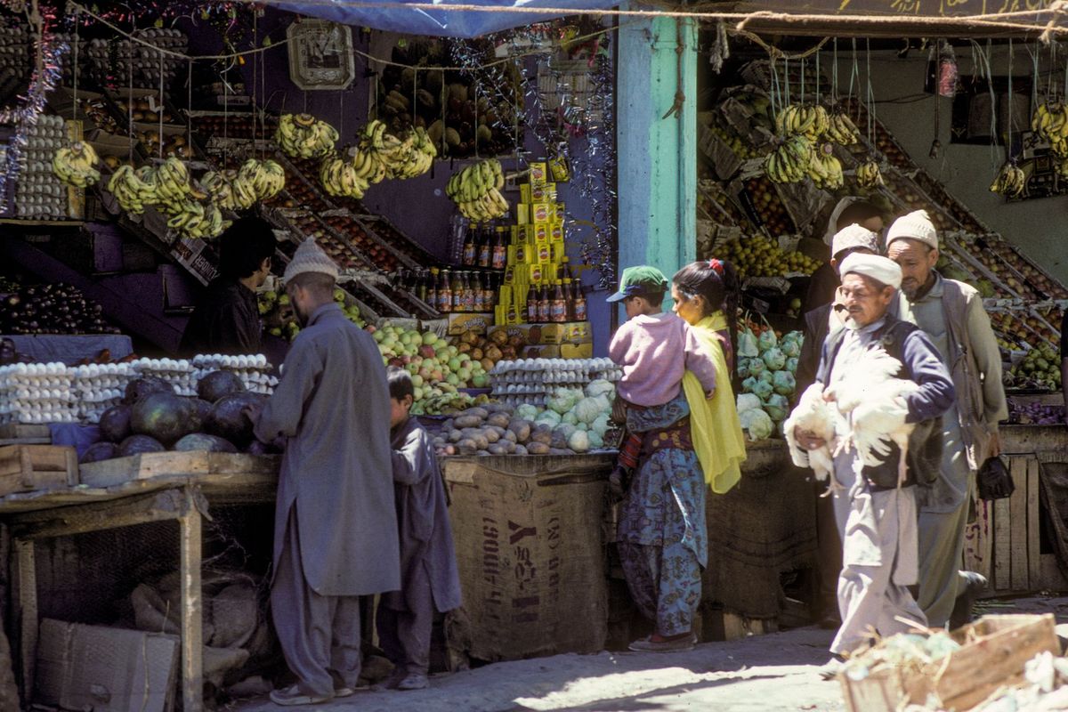Busy fruit and vegetable market stalls in Leh bazaar