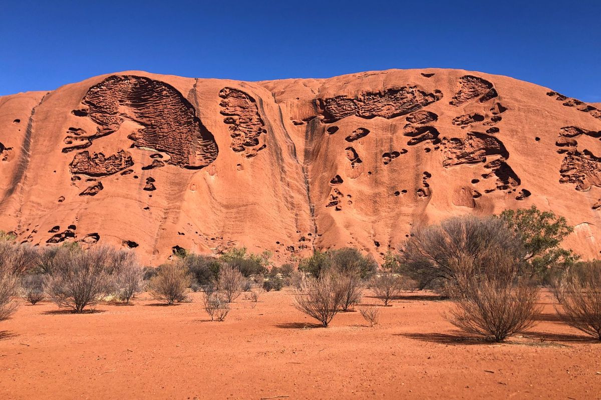 The red sandstone face of Uluru, Northern Territory Australia
